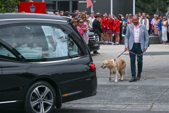 Bianca’s father, Mark, with her dog, Zara, following the hearse.