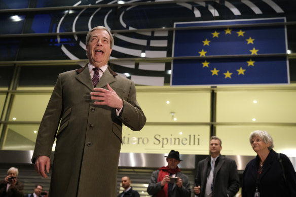 Nigel Farage speaks to the media as he departs following a historic vote for the Brexit agreement at a session of the European Parliament on January 29.