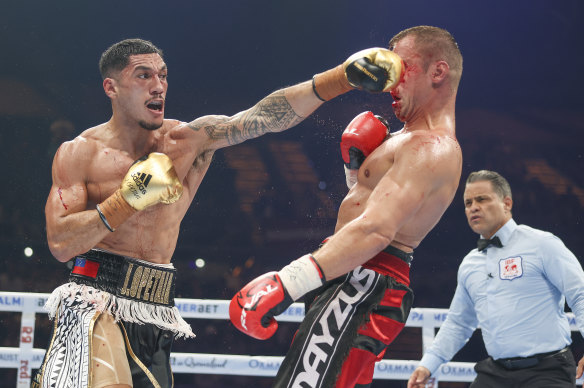 Jai Opetaia lands a punch on Mairis Briedis at the Gold Coast Convention and Exhibition Centre on Saturday night.