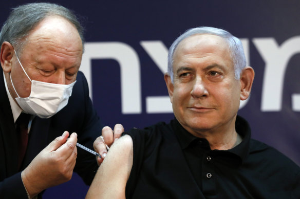 Israeli Prime Minister Benjamin Netanyahu receives a coronavirus vaccine at Sheba Medical Centre in Ramat Gan, Israel  in December.