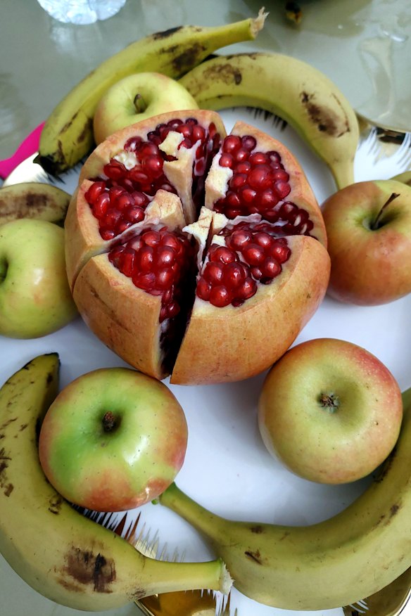 Fruit for dessert, featuring the biggest pomegranate any of us have ever seen.