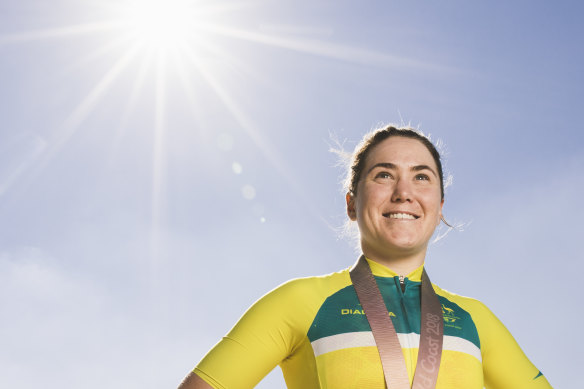 Canberra cyclist Chloe Hosking, pictured here after winning a Commonwealth Games gold medal,  said she takes care to avoid training in the middle of the day.