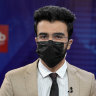 TV anchor Hamed Bahram wears a face mask to protest the Taliban’s new order that female presenters cover their faces as he reads the news on TOLOnews, in Kabul on May 22. 
