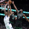 Dallas Mavericks forward P.J. Washington (25) is blocked by Boston Celtics’ Derrick White (9) and Jaylen Brown (7).