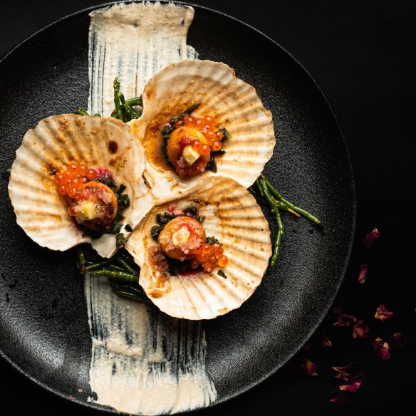 Interlude Bar’s scallops with warrigal greens.