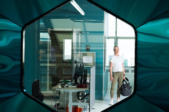 Journalist Sarah Berry outside the metabolic chamber at the Australian Catholic University, Melbourne. Being inside it is like being on a plane to nowhere, she says, “yet I’m aware it could transport some people towards a new and healthier life.”