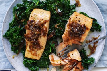 Salmon fillets with caramelised onion and wilted greens.