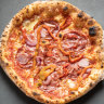 Pizza Diavola with spicy salami, onion and roasted capsicum.