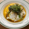 Vadouvan eggs: Poached eggs drizzled with spiced ghee and garnished with zaatar over herbed carrot puree and lemon labne.