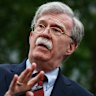 FILE - National security adviser John Bolton talks to reporters about Venezuela, outside the White House, May 1, 2019, in Washington. (AP Photo/Evan Vucci File)