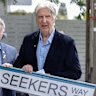 The Seekers’ Bruce Woodley is presented with a replica of the street sign by City of Port Phillip councillor Serge Thomann.