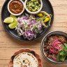 The go-to dish: falling-apart lamb barbacoa served with warm flour tortillas.