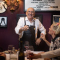 No bread plates: Bistro Thierry owner Thierry Cornevin with customers Alice Wells and Jack Lodge.