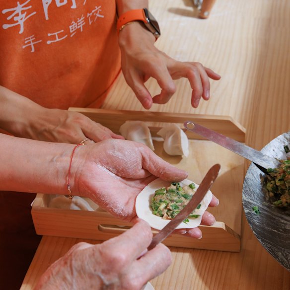 Aunty’s mother-daughter duo makes up to 1600 dumplings a day in the open kitchen.