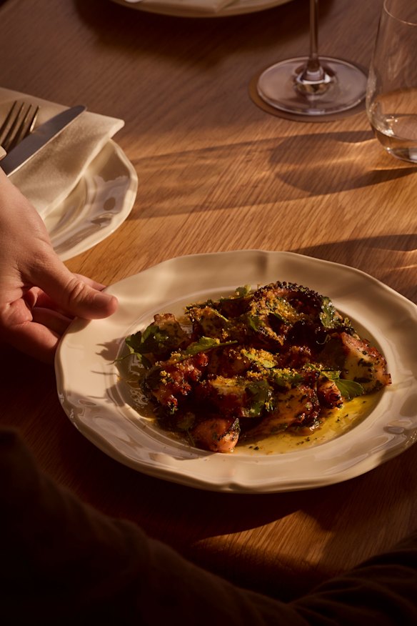 Barbecued Fremantle octopus with tomato pesto and rocket. 
