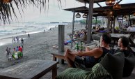 Locals and foreigners soak up life by the beach in Bali last week.