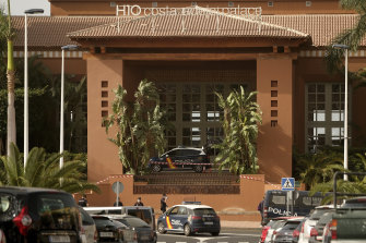 Spanish police officers stand outside the H10 Costa Adeje Palace hotel in Tenerife.