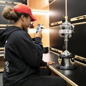 The new champion couldn’t resist taking her own photo of the trophy in the locker room after her emphatic win.