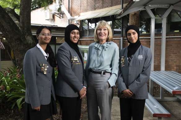 Harvey Norman chief executive Katie Page with Auburn Girls High School students (from left): Hasini Poddaturu, Adeena Khan and Sarah Chaudhary.