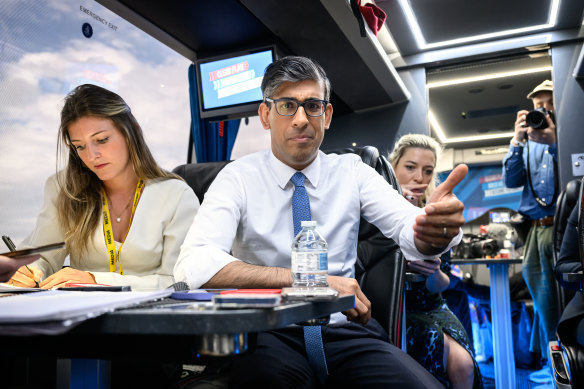 Prime Minister Rishi Sunak speaks to journalists on the campaign bus.