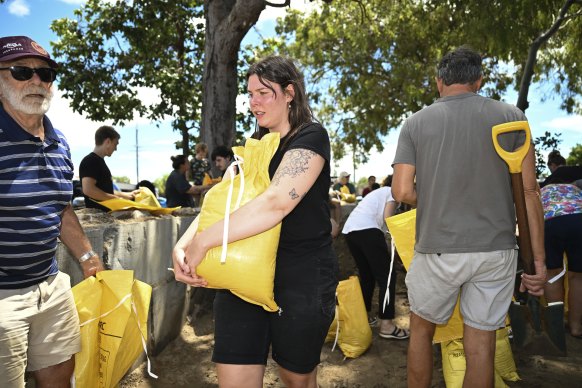 Residents collect sandbags from a council depot on Bribie Island.