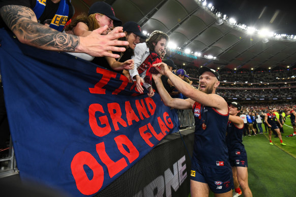 Demons captain Max Gawn celebrates with the Melbourne faithful after the grand final win in Perth.