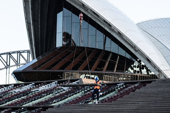 A worker on site assists in the removal of the Monumental Steps.