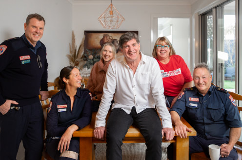 Thank you: Mark Hardeman (centre) reunited with paramedics and neighbour Meabh Cullinane (third from left) at his Cheltenham home.