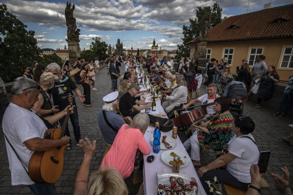 Prague residents dine on a 500-metre long table set on the Charles Bridge in June.