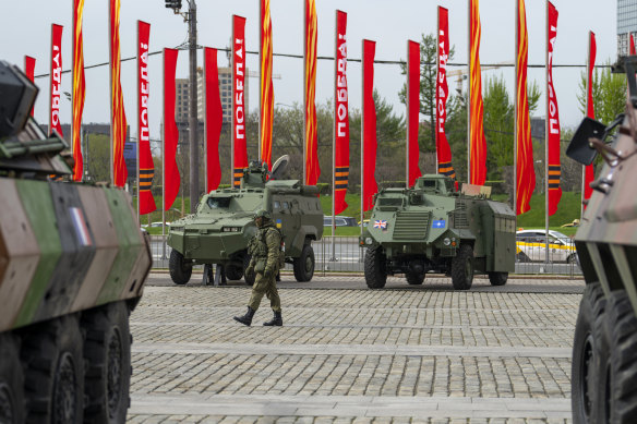 A Russian soldier guards an exhibition of tanks, vehicles and guns captured from Ukrainian armed forces and on display near the World War II museum in Moscow.