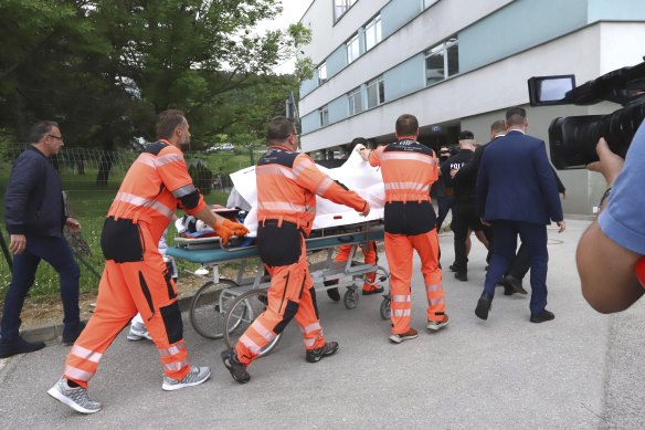 Rescue workers take Slovak Prime Minister Robert Fico, who was shot and injured, to a hospital in the town of Banska Bystrica.