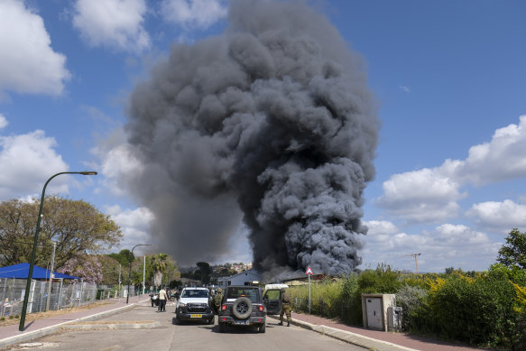 Smoke rises from a fire after rockets fired from Lebanon struck Bezet, northern Israel, on Thursday.