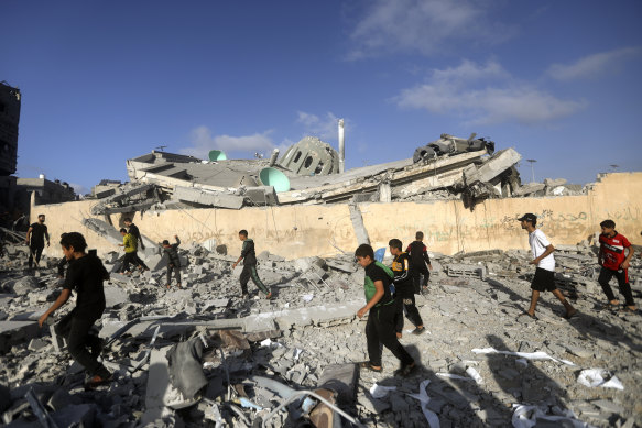Palestinians inspect a destroyed mosque after an Israeli airstrike in Khan Younis refugee camp, south Gaza.
