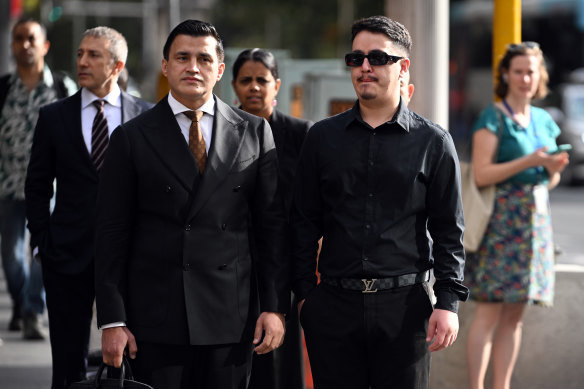 Ahmed Rashid Nadir (right) arrives at the Downing Centre Local Court on Wednesday morning.