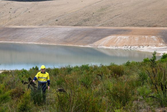 Alcoa’s Warren Sharp among the vegetation on the former mine walls in Anglesea. 