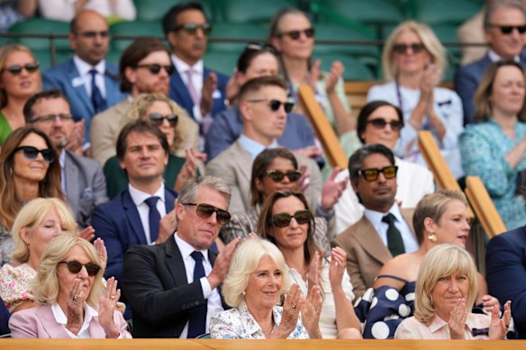 Hugh Grant (second row) and Queen Camilla (bottom centre) in the Royal Box at Wimbledon on Wednesday.