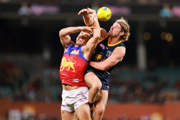 Brisbane’s Brandon Starcevich and Sam Berry of the Crows battle for possession.