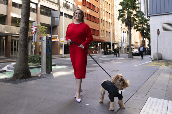 Gina Edwards and Oscar outside court in 2024.