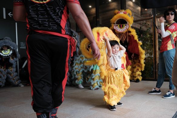 Jasper Ching, 4, performs with Lion Dance Kids as part of Lunar New Year celebrations in Chatswood on Saturday.