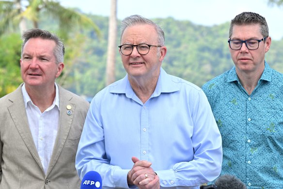 Climate Change Minister Chris Bowen, left, standing alongside Prime Minister Anthony Albanese and Pacific Island Affairs Minister Pat Conroy earlier this week in Palau.