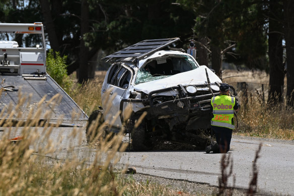 Police remove the ute from the scene.