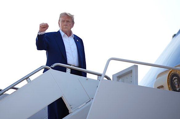 Trump boards Air Force One to fly to the NATO summit.