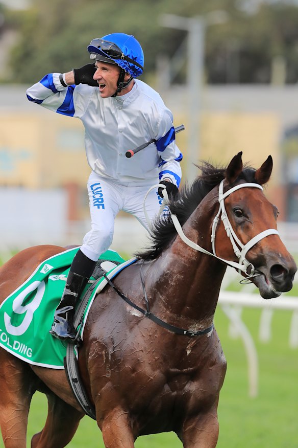 Glen Boss reacts to the crowd after winning the Epsom on Kolding.