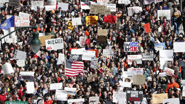 Students march during a walkout to protest against gun violence in Madison, Wisconsin.