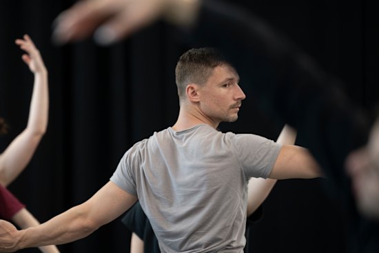 Choreographer James Batchelor with dancers rehearsing Resonance.