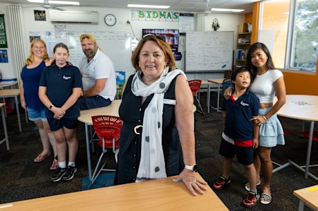 Doveton College principal Deb Gibson (centre) with parents Belinda and Peter Willoughby and their daughter Angelina (left) and Raneth Ung with son VannaKrath Neth , 7 (right).
