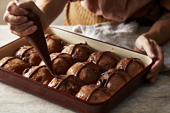 Add the crosses using a piping bag with a small nozzle.