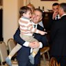 Health Minister Mark Butler with his son at the swearing-in ceremony at Government House.