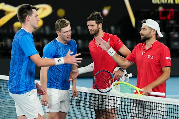 Harri Heliovaara of Finland and Henry Patten, left, of Britain are congratulated by Italy’s Simone Bolelli, right, and Andrea Vavassori after winning the men’s doubles final.