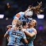 Blues teammates celebrate a try in the second half.